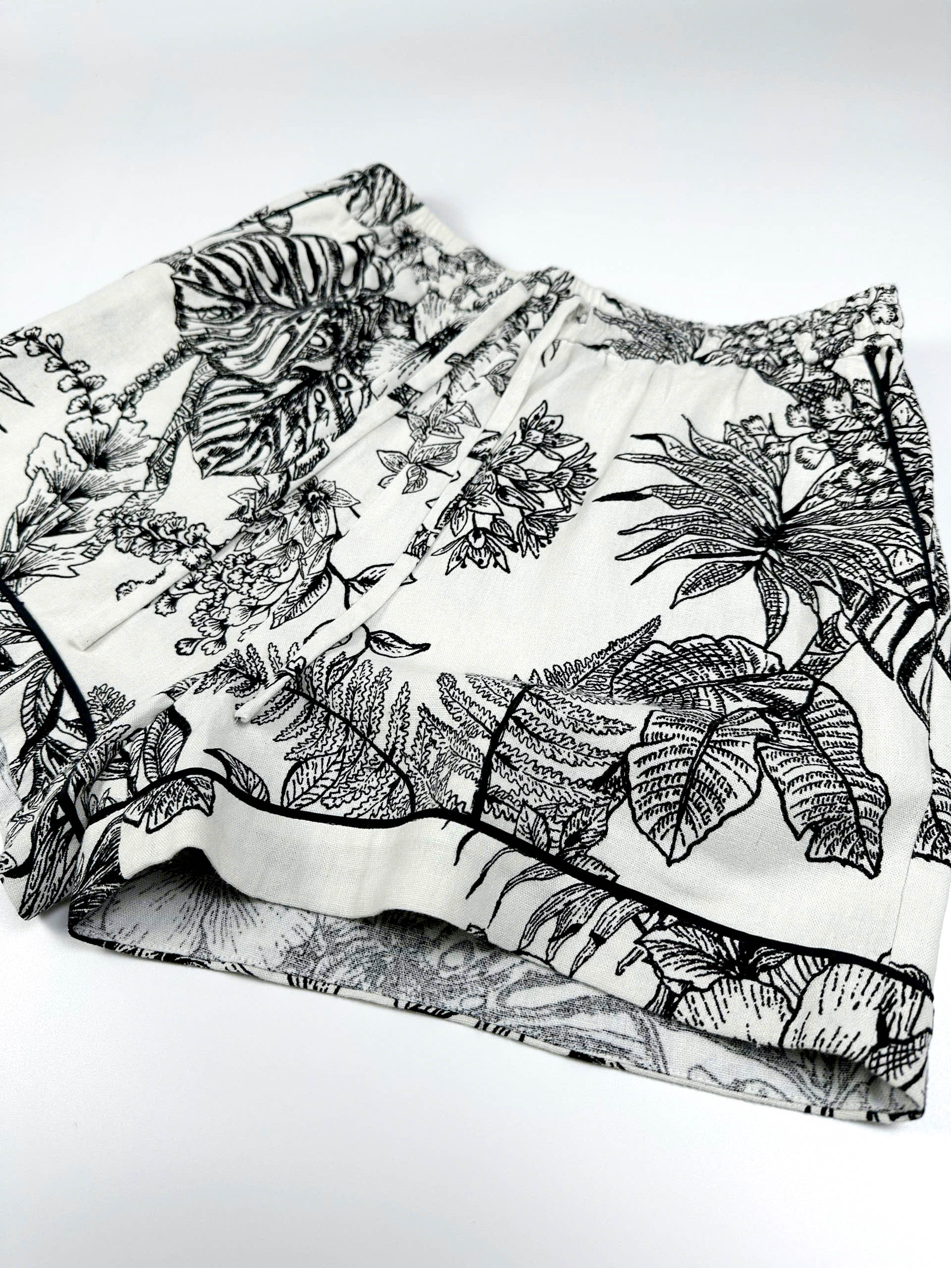 Saigon Concepts Short sleeve cotton-linen pyjama shorts with botanical print and contrasting trim  - side detail view