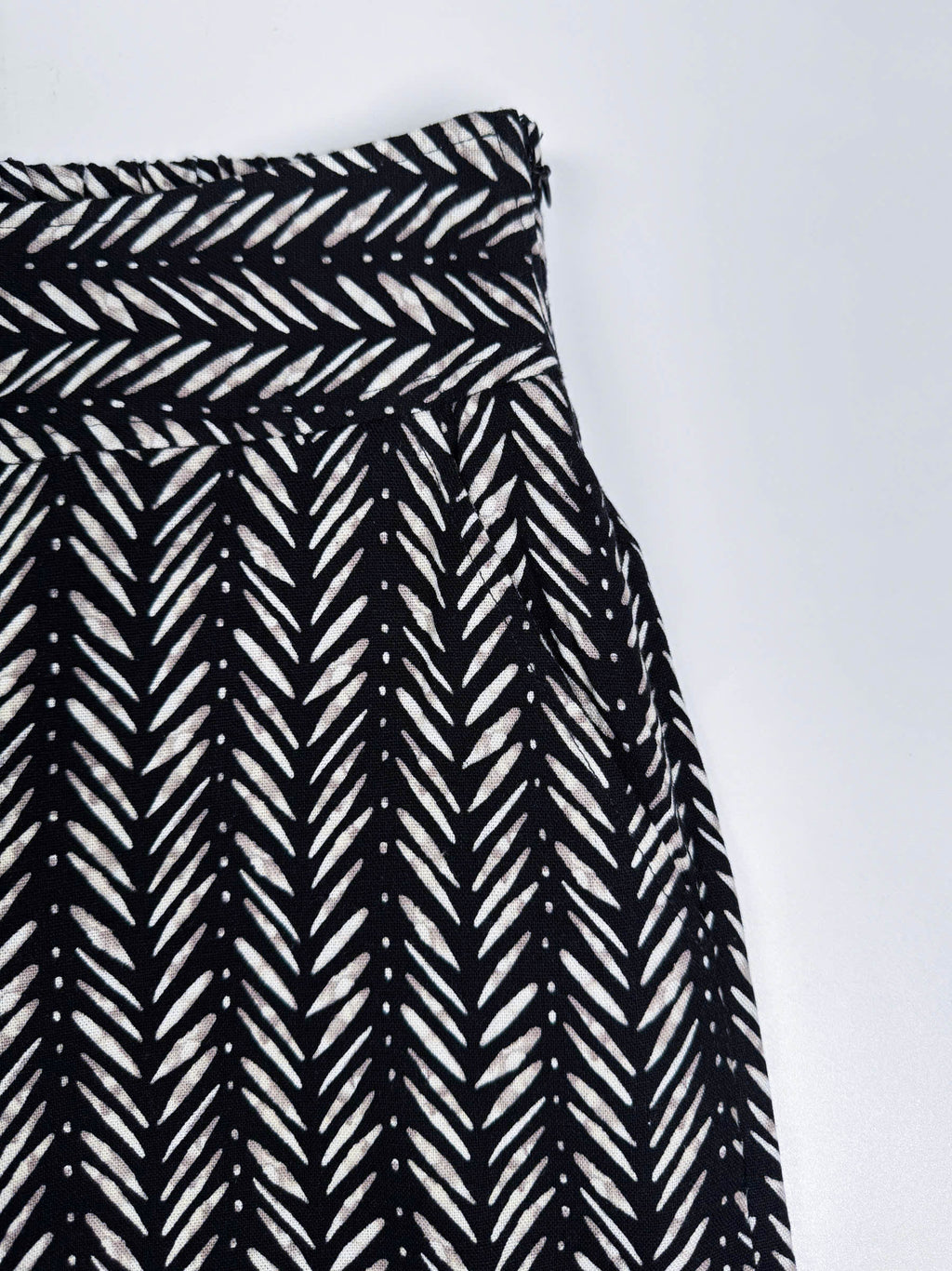 Saigon Concepts Chevron Safari Linen Pants with white chevron painted lines print on black - front pocket detail view