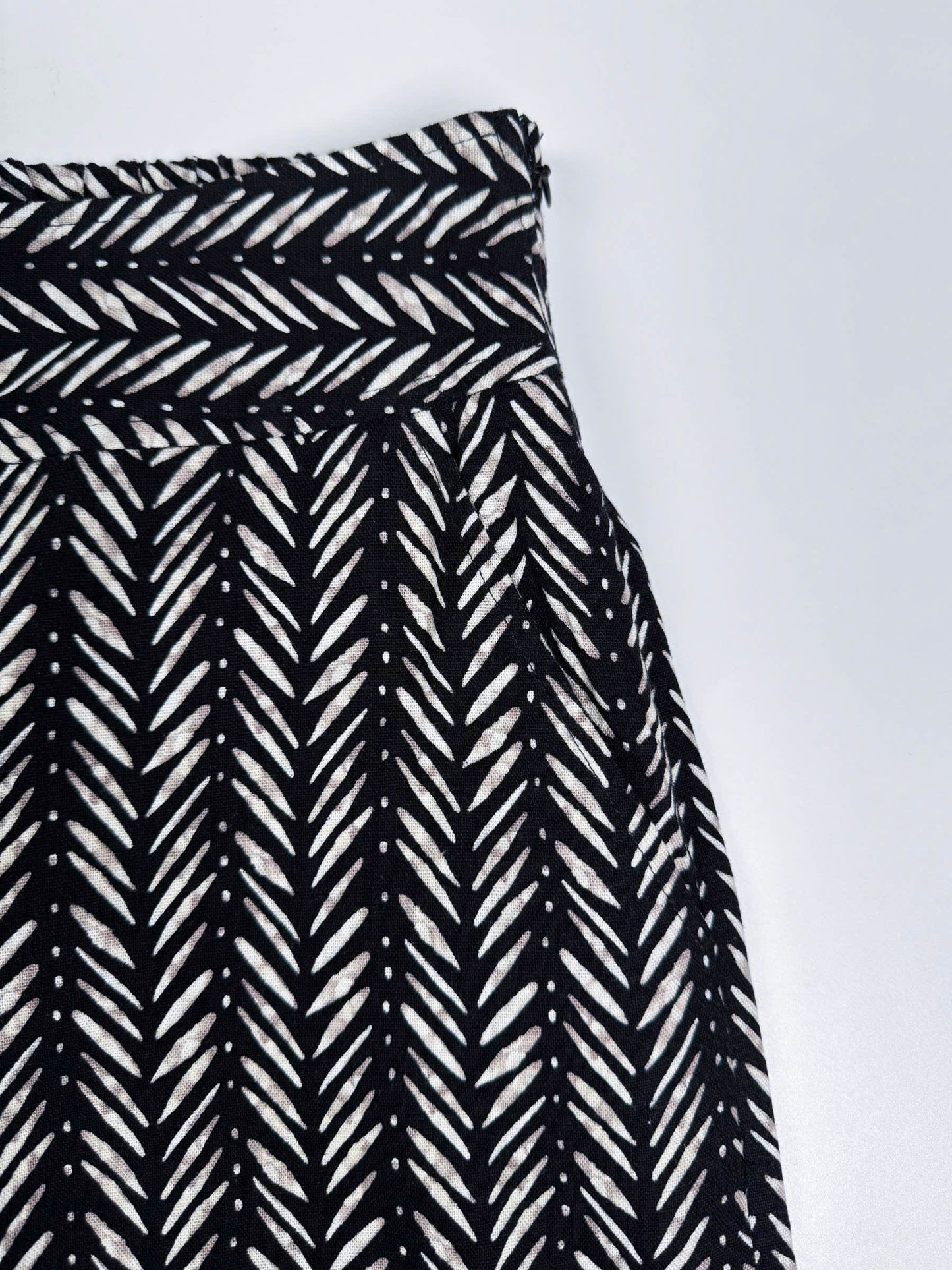 Saigon Concepts Chevron Safari Linen Pants with white chevron painted lines print on black - front pocket detail view