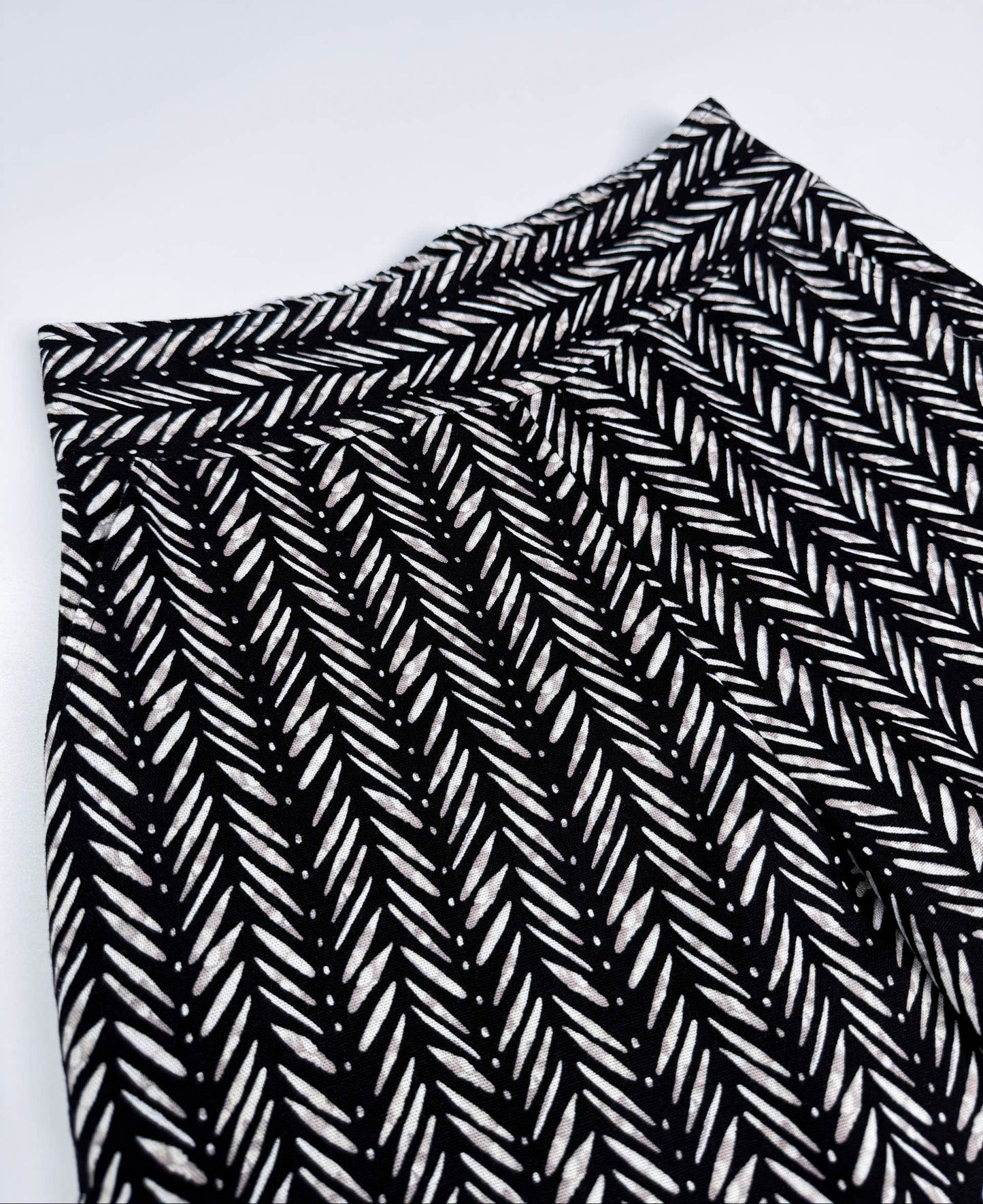 Saigon Concepts Chevron Safari Linen Pants with white chevron painted lines print on black - front waistband view