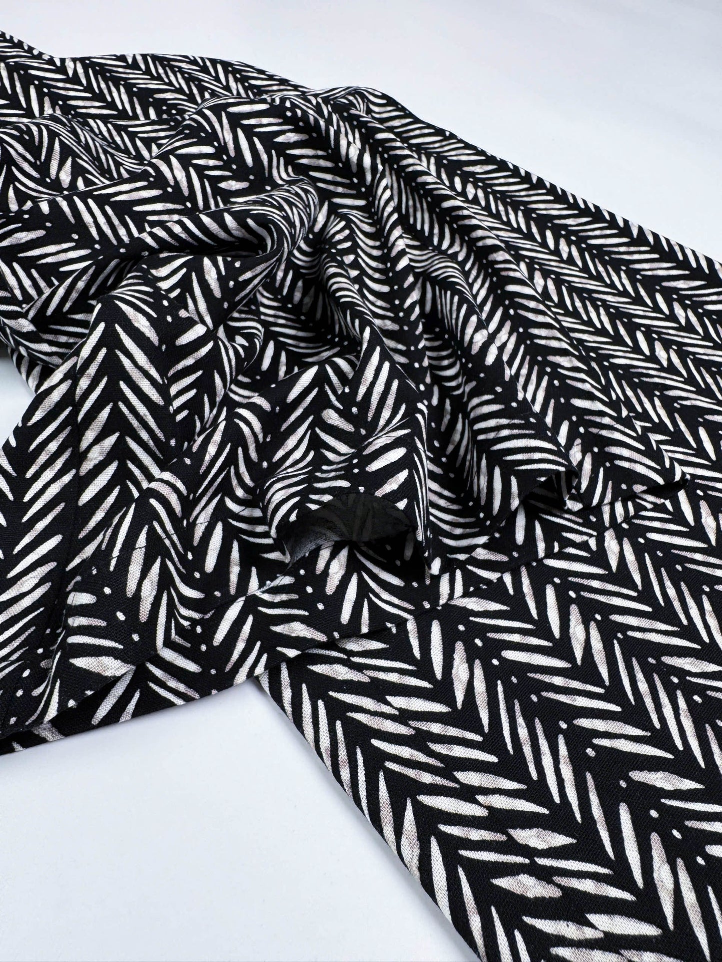 Saigon Concepts Chevron Safari Linen Pants with white chevron painted lines print on black - leg seam detail view