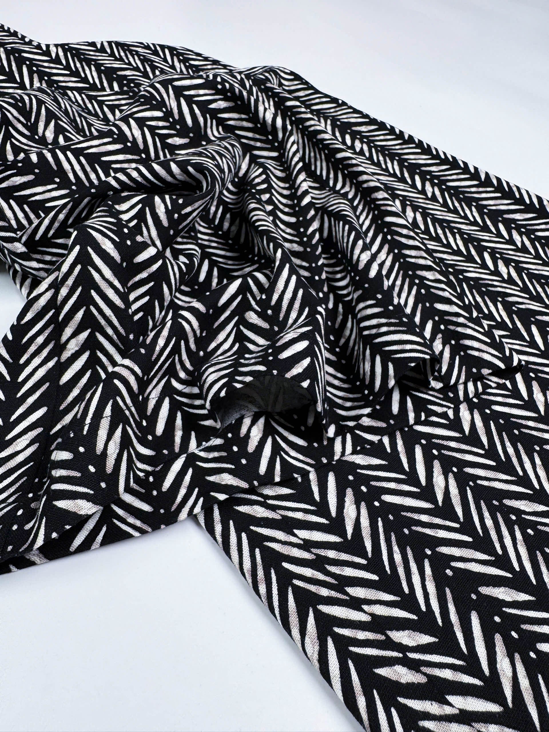 Saigon Concepts Chevron Safari Linen Pants with white chevron painted lines print on black - leg seam detail view