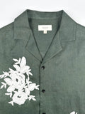 Saigon Concepts Deep Army Green Hawaiian Linen shirt with white floral lace on a light grey background - front collar view