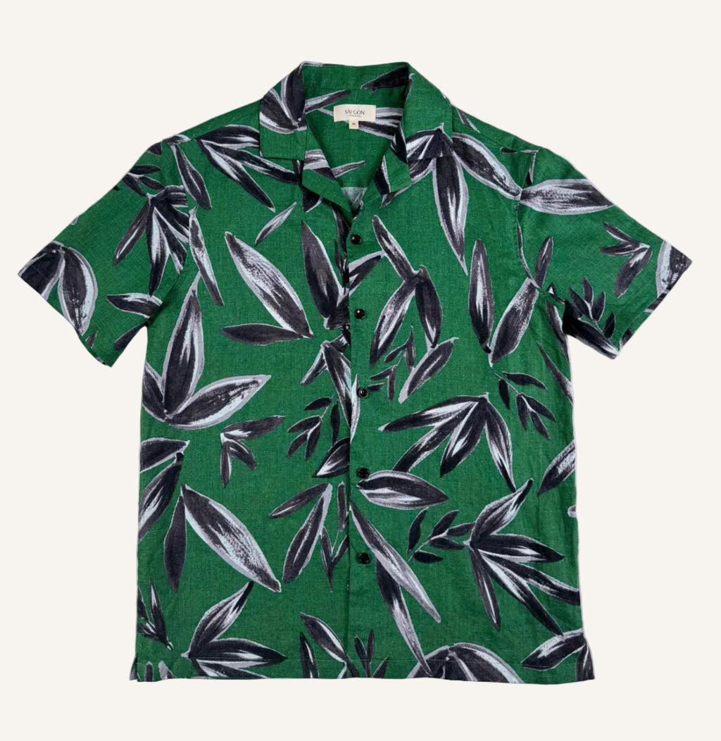 Saigon Concepts Green linen shirt with black leaf pattern on a white background - full front view