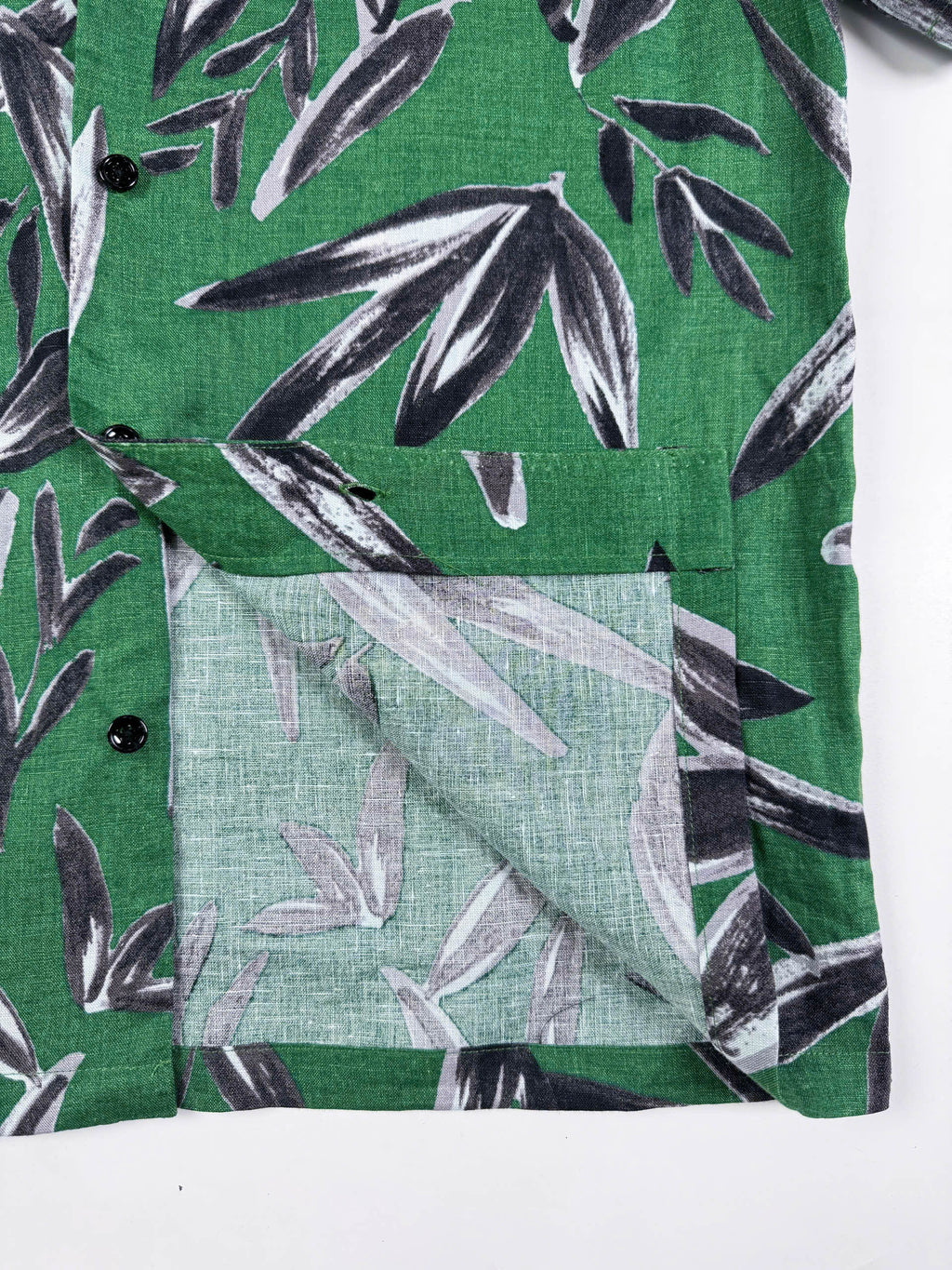 Saigon Concepts Green linen shirt with black leaf pattern - seam detail view
