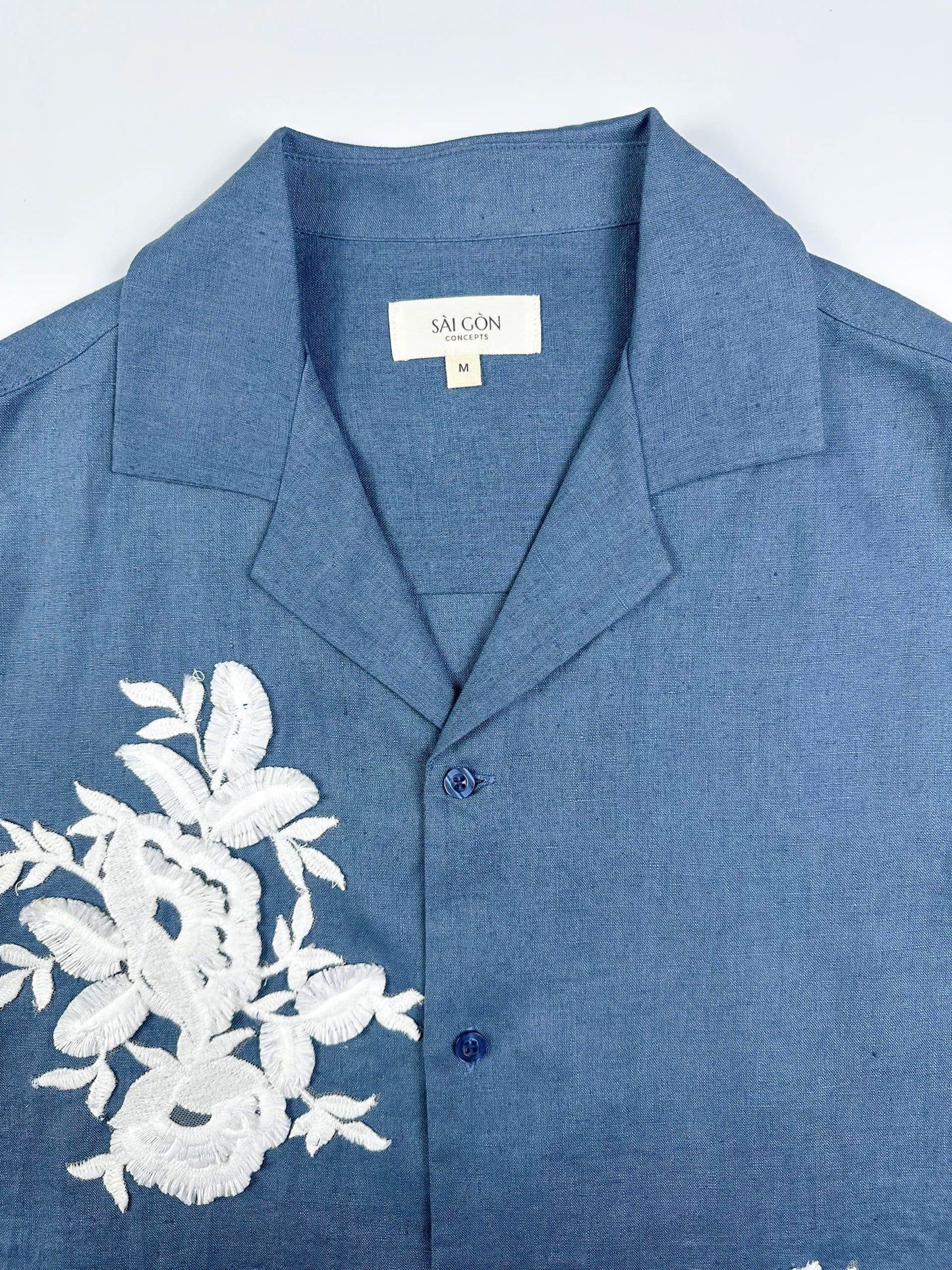 Saigon Concepts Blue steel linen Hawaiian shirt with white lace appliqué detail - front collar view