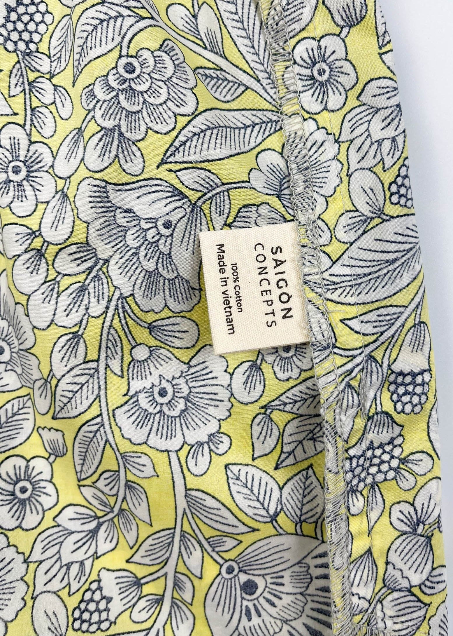 Sunshine Chintz pyjama shorts inside care label detail. yellow and grey floral print - Saigon Concepts