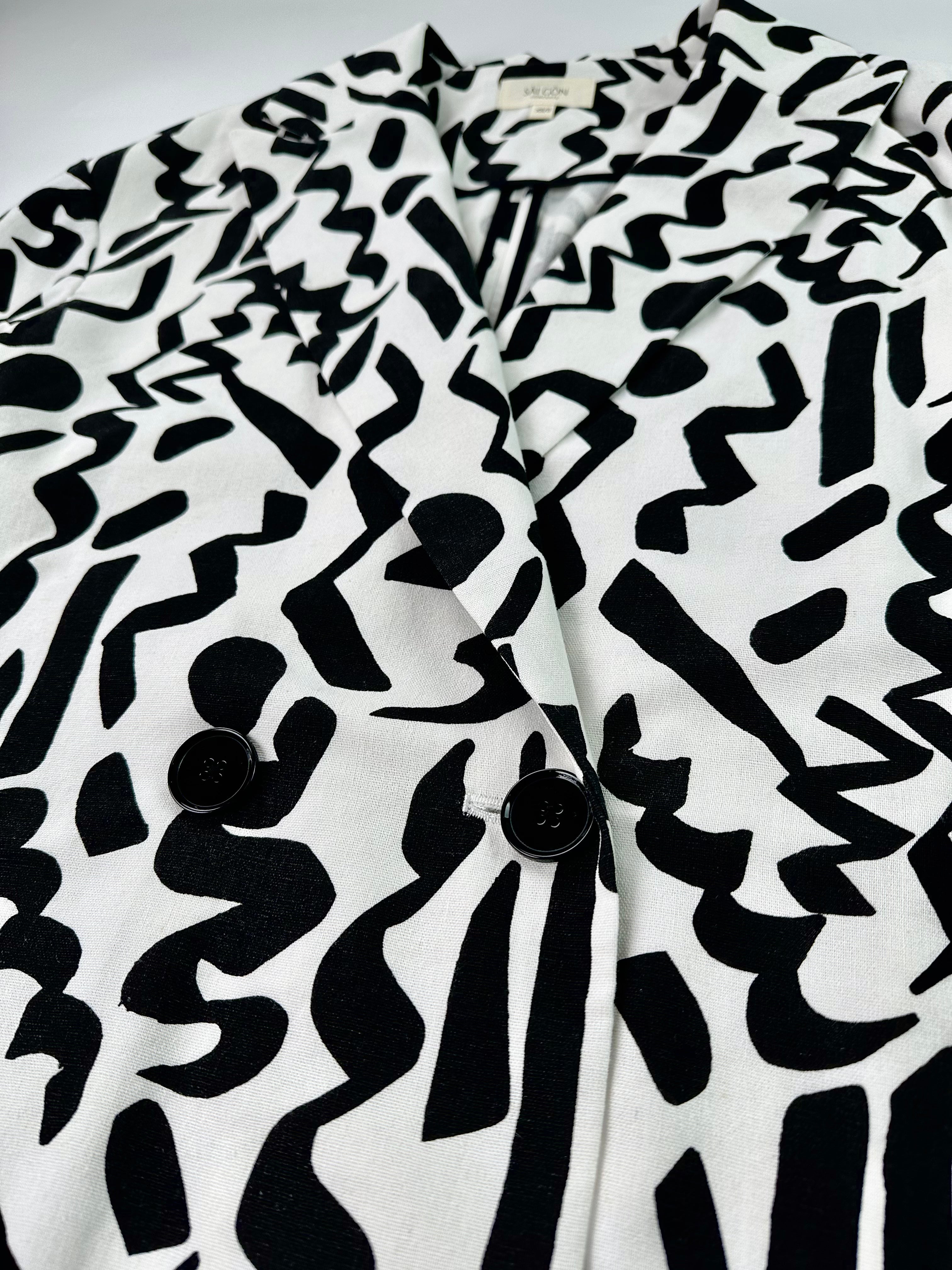 Saigon Concepts Black and white Urban Canvas patterned jacket on a light grey background - front button detail view