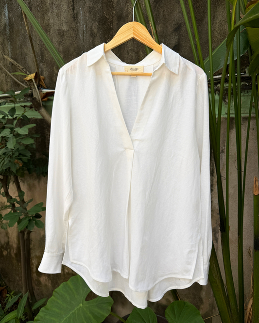 Saigon Concepts White Linen-mix v-neck long sleeve blouse on hanger in garden showing front view detail 