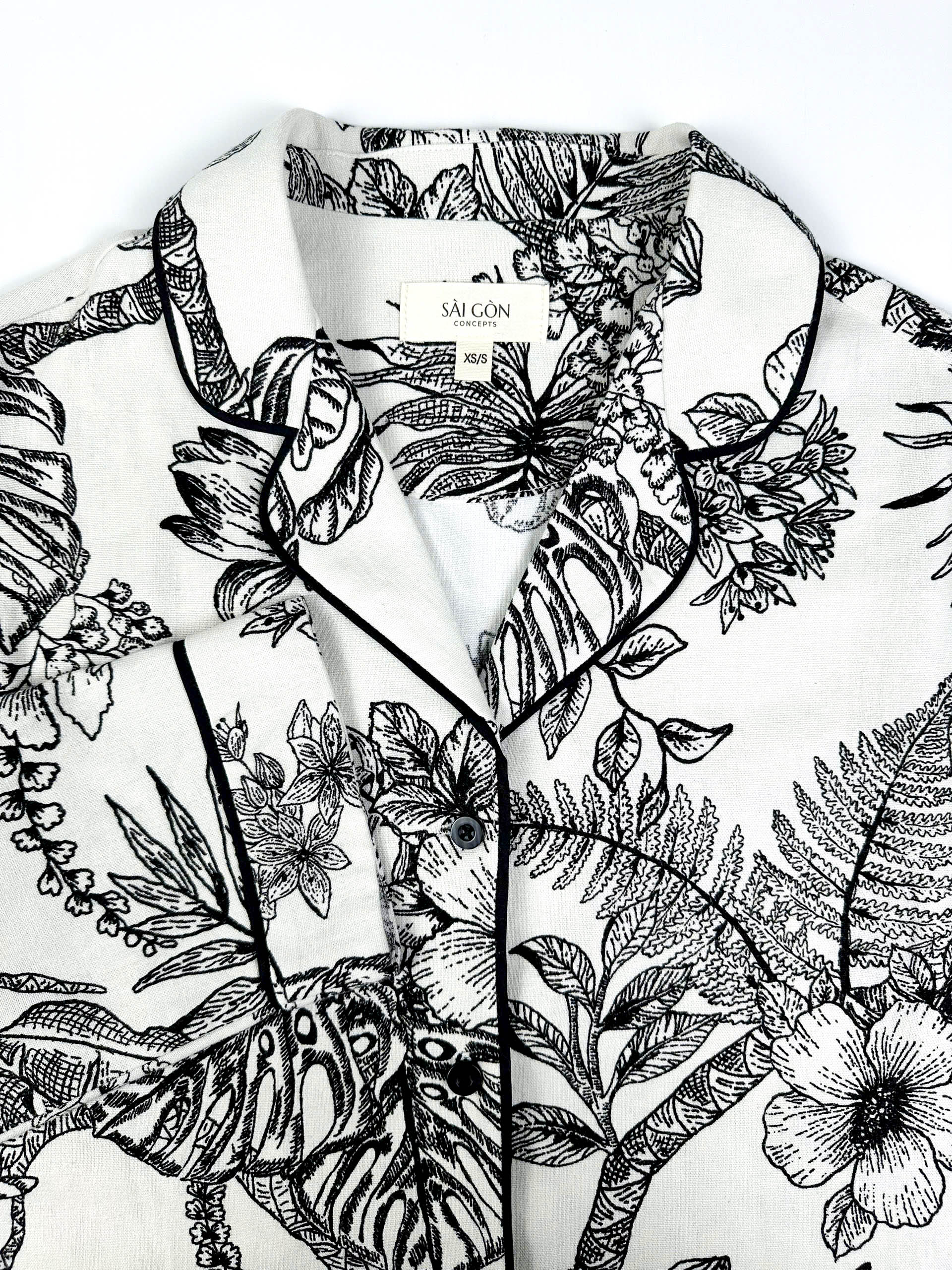 Saigon Concepts Botanical Noir Longline PJ Top with black floral etched drawing on white linen - collar view with contrasting black piping.