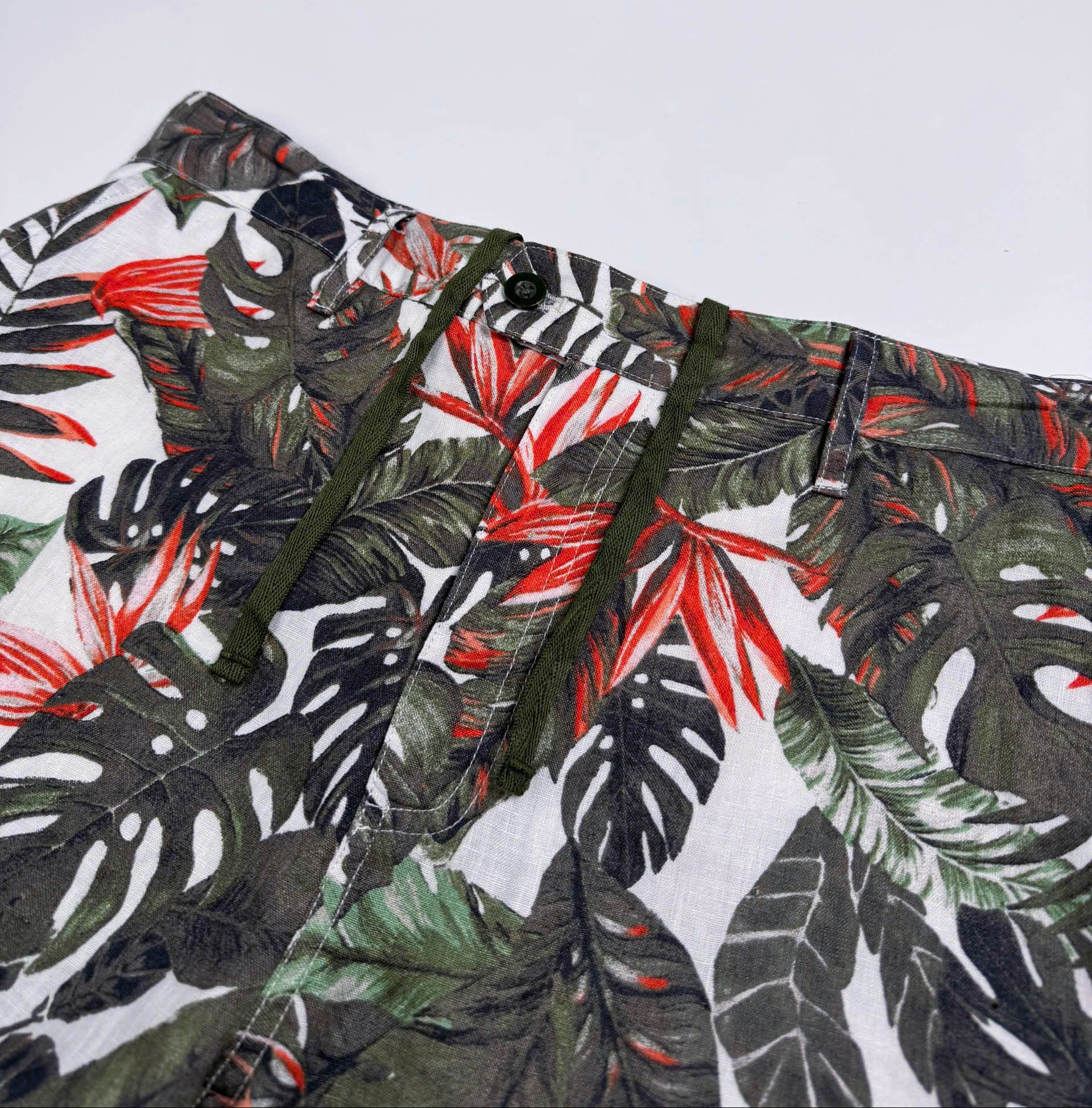 Saigon Concepts Fire & Fern Tropical Print Linen Shorts - front waistband with drawstring cord view 