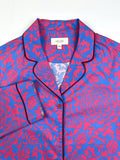 Saigon Concepts Close-up of Jardin Royale long line PJ top showing contrasting dark wine piping on collar and elegant floral print