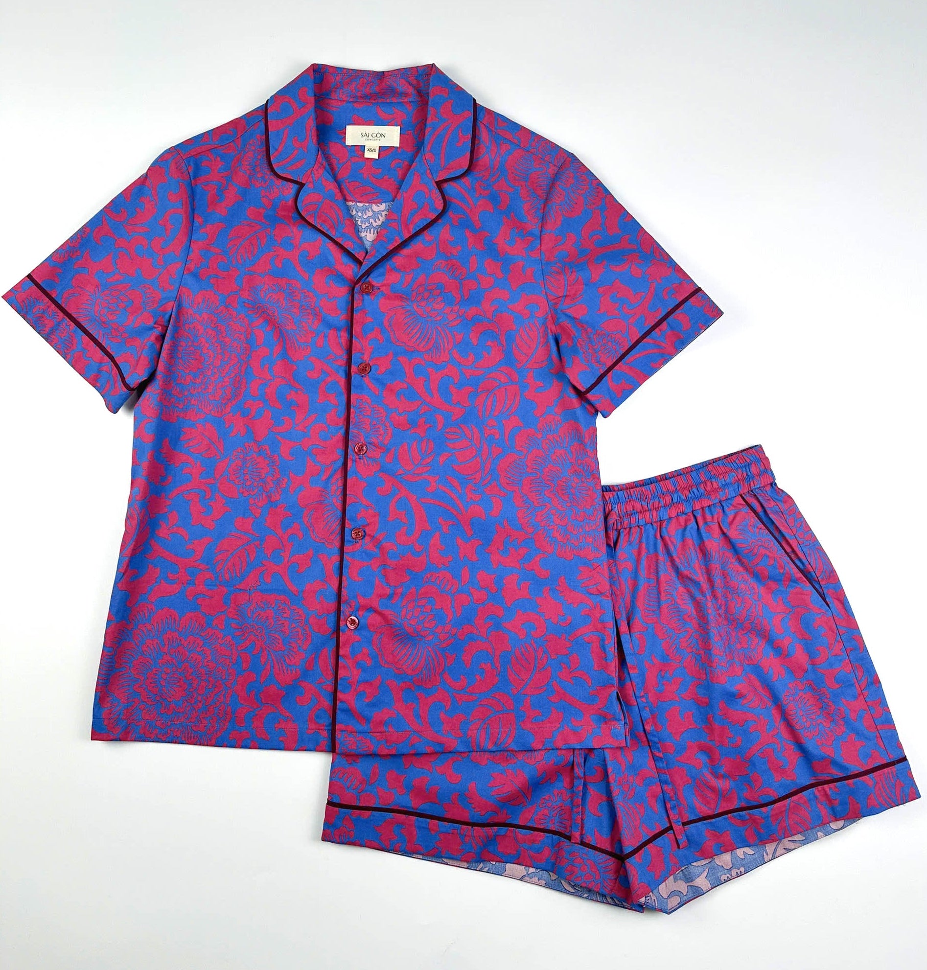Saigon Concepts Jardin Royale Short Sleeve Pyjama Top & matching shorts - 100% cotton with red-pink floral print on a sea note blue background with contrasting wine trim - Lounge to Street collection made in Vietnam