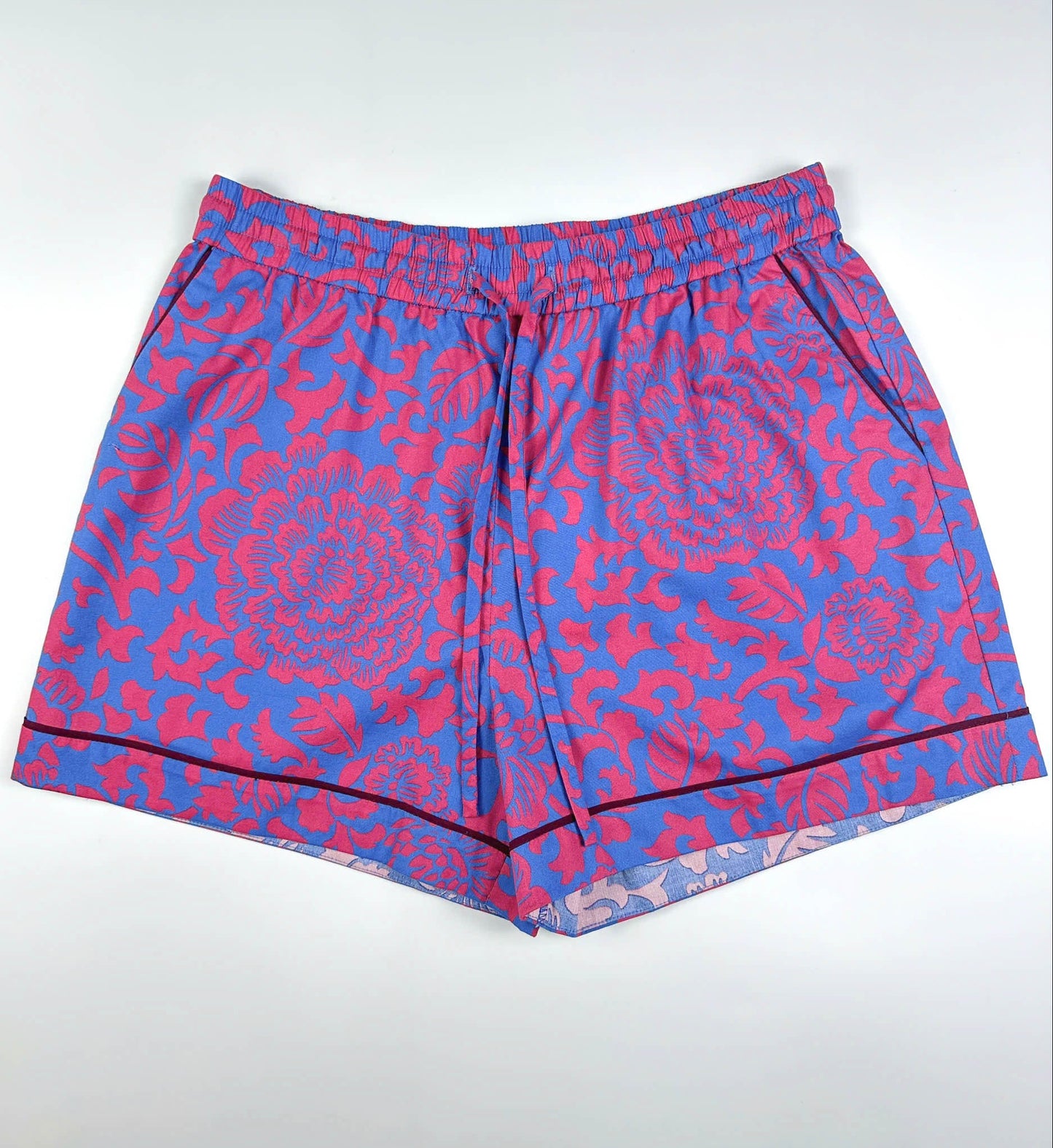 Saigon Concepts Jardin Royale lounge pyjama shorts in 100% cotton with red-pink floral print on a sea note blue background with contrasting wine trim - Lounge to Street collection made in Vietnam