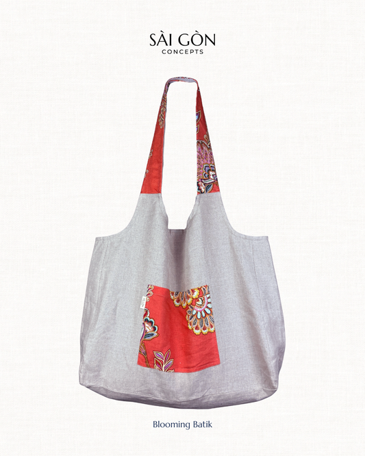 Saigon Concepts natural linen tote bag with coral pink floral accents on a natural linen colour background