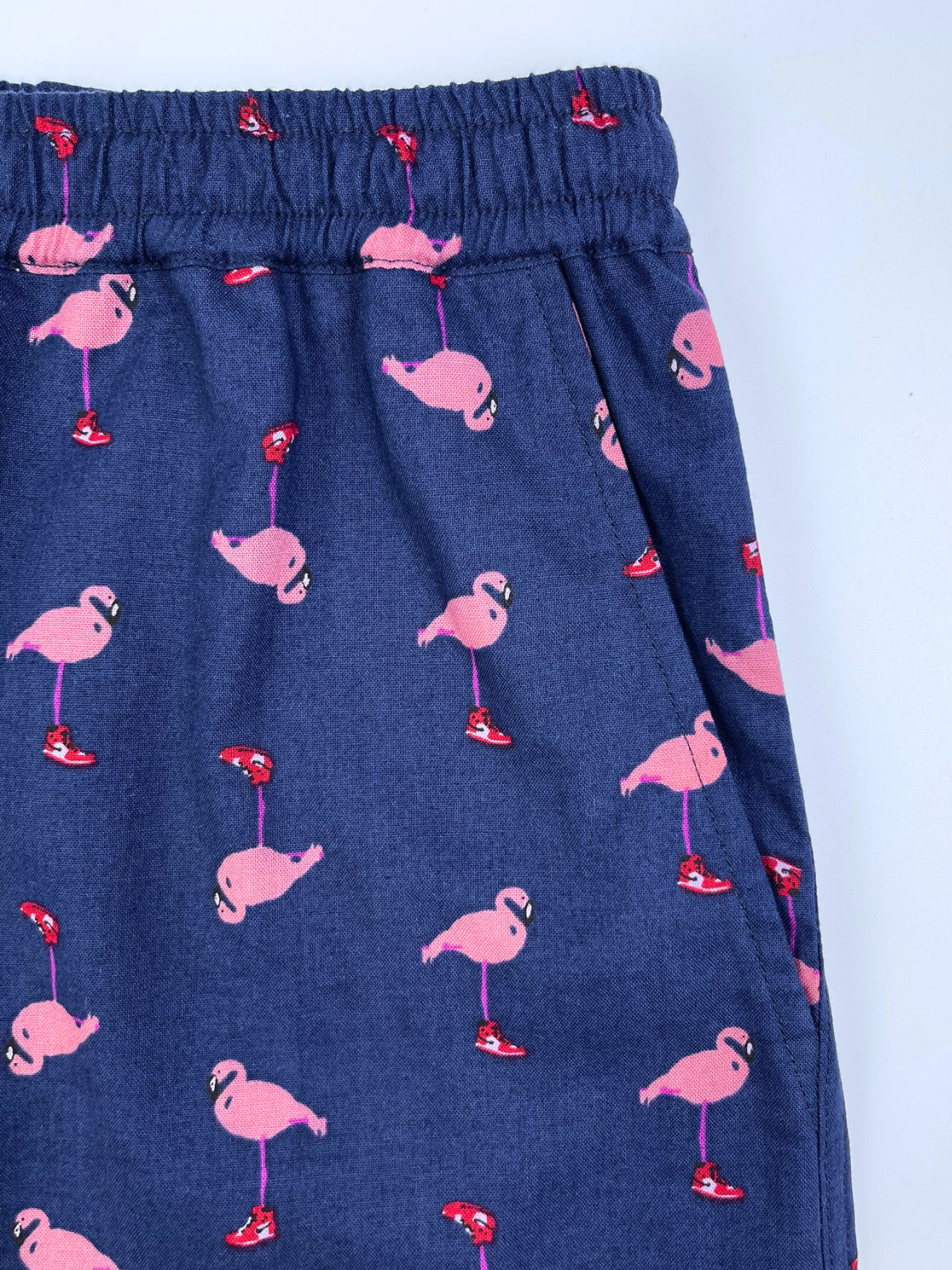 Saigon Concepts Pink flamingo print lounge shorts on navy cotton with drawstring waist - side pocket detail