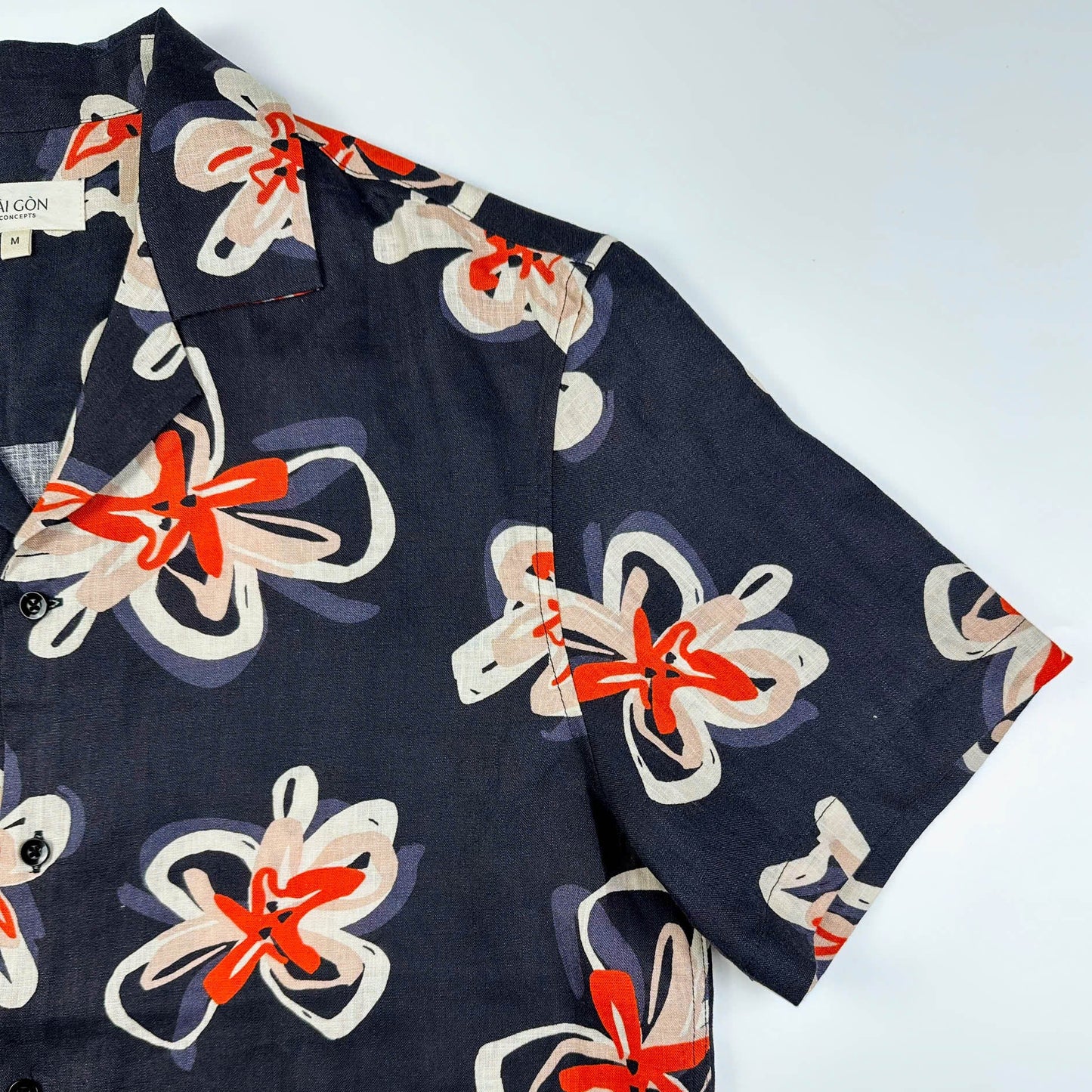 Saigon Concepts Pacific Nights Hawaiian shirt in 100% linen with abstract floral print in navy, beige, and orange-red - Sleeve detail -  sustainable resort wear made in Vietnam