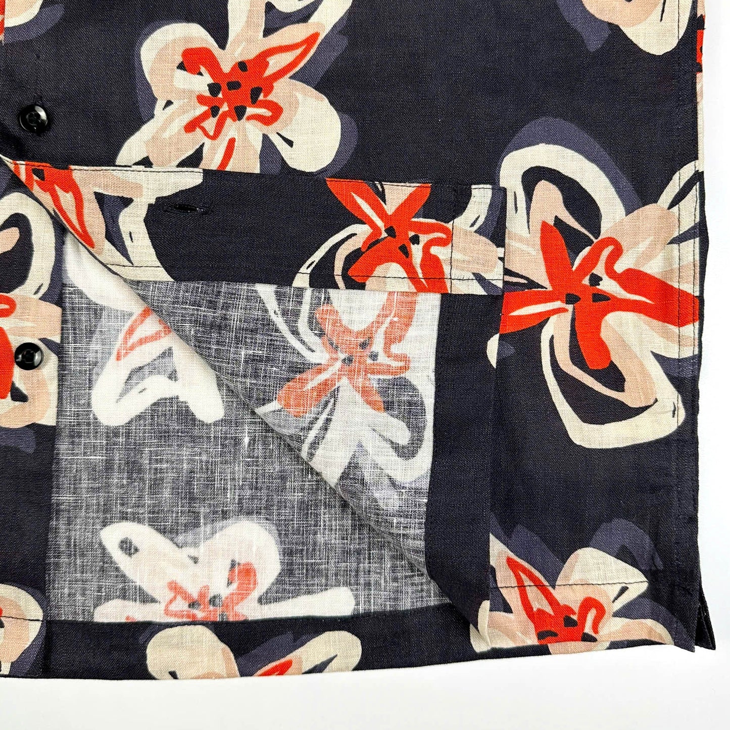 Saigon Concepts Pacific Nights Hawaiian shirt in 100% linen with abstract floral print in navy, beige, and orange-red - inside edge detail