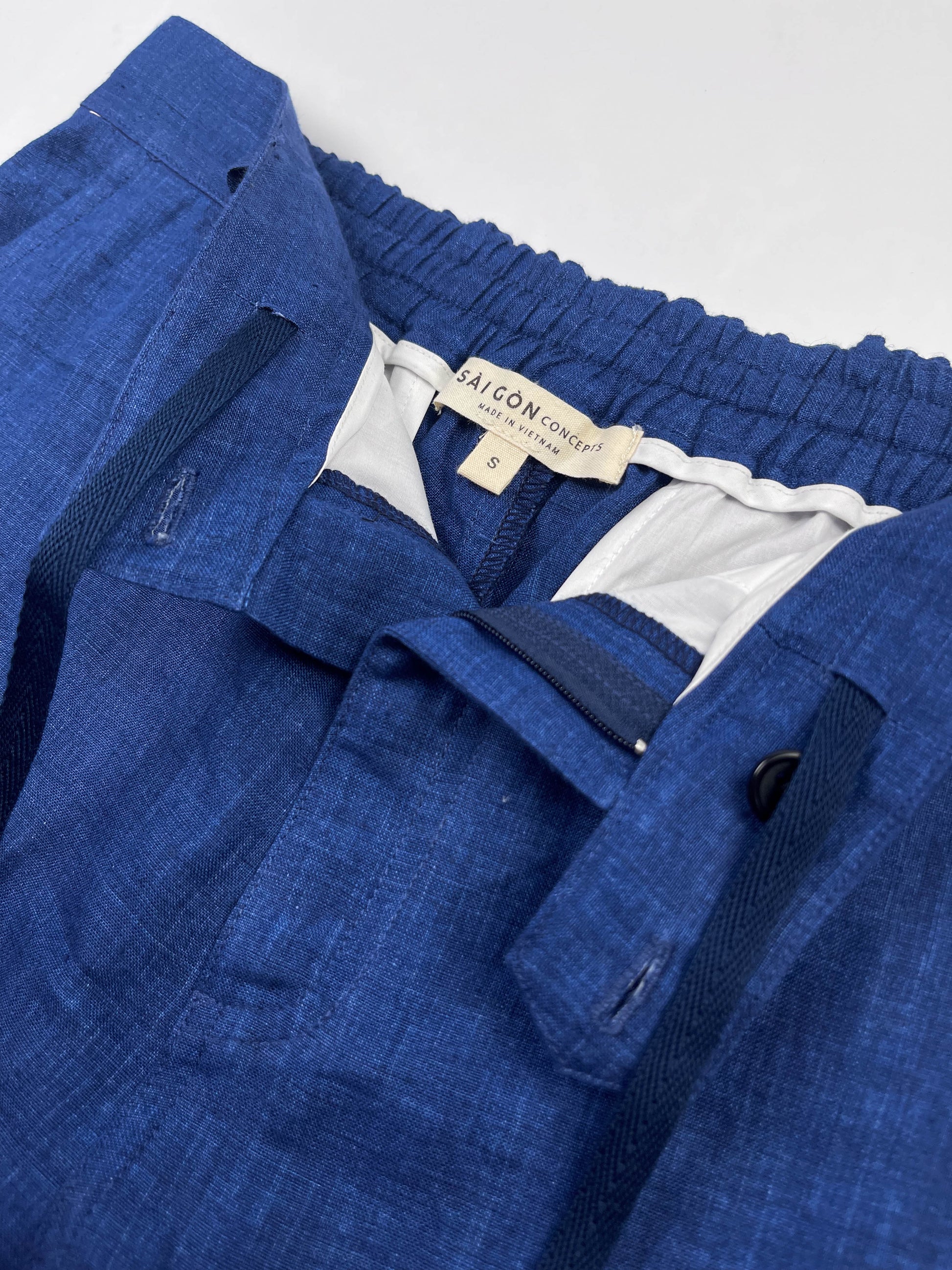 Saigon Concepts Mid Blue Riviera Linen Shorts - flat front inside drawstring view with zipper detail 