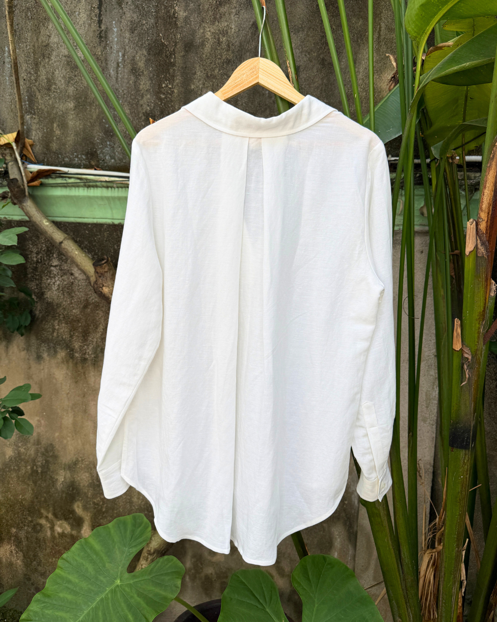 Saigon Concepts White Linen-mix v-neck long sleeve blouse on hanger in garden showing full back view detail 