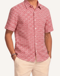 Model wearing Saigon Tiles short sleeve button-up shirt lay flat front collar detail view, terracotta and white geometric tile print