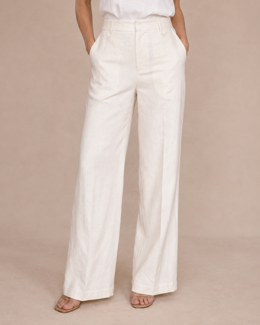 Woman wearing ivory wide-leg pants with a tank top, full-length front view