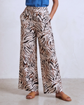 Flat front view of white and black zebra-stripe print wide-leg pants