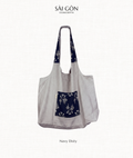 Natural linen tote bag with a navy floral ditsy print pocket panel, Saigon Concepts label