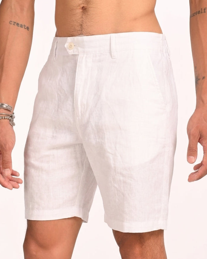 White linen shorts worn by a model, shown from the waist down against a plain white background.