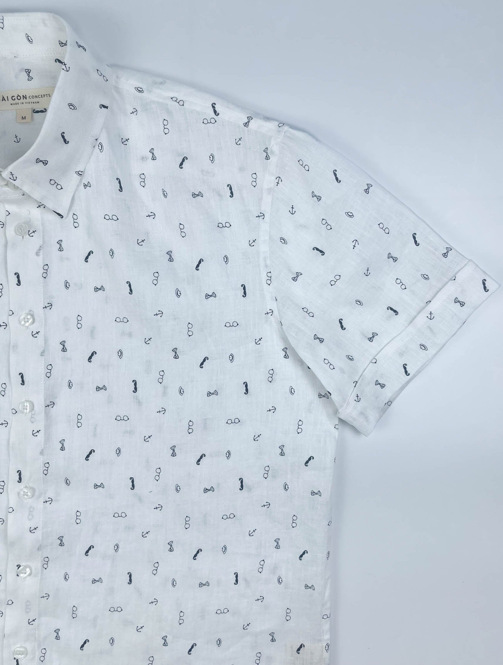 Gentlemen Club linen short sleeve button-up shirt lay flat sleeve detail view, minimalist print