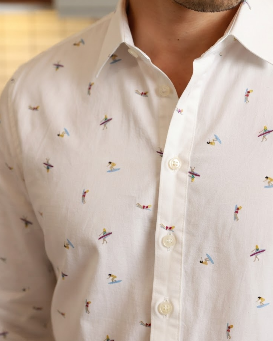 Close-up of Tide Rider surfer print on white cotton shirt
