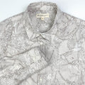 Tropicana Parrot long sleeve button-up shirt lay flat collar detail view, parrot and foliage print on natural white linen