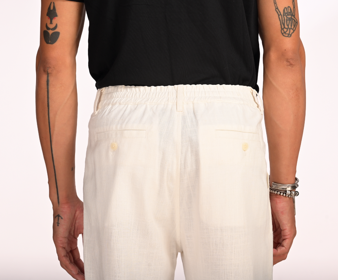 Man wearing Saigon Concepts White Linen Cotton Coastal pants - full backside view of pockets and elasticated waistband