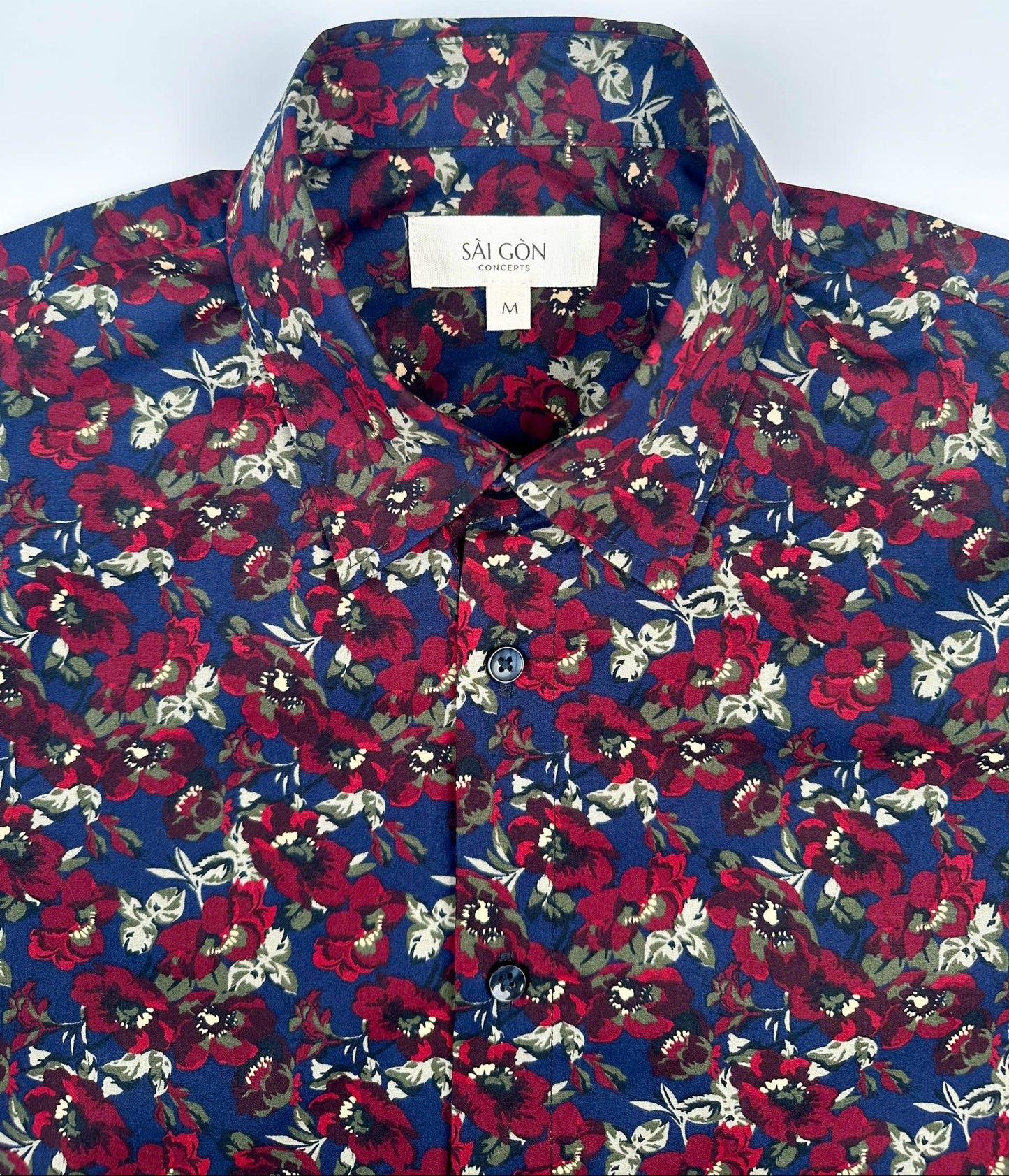 Wild Burgundy cotton short sleeve button-up shirt lay flat collar view, burgundy floral print on navy blue.