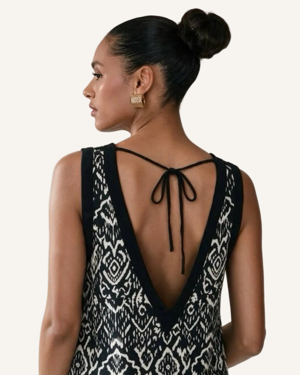 Bohemian Noir linen mini dress worn reversed, deep V open back with adjustable neck tie