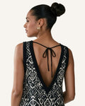 Bohemian Noir linen mini dress worn reversed, deep V open back with adjustable neck tie