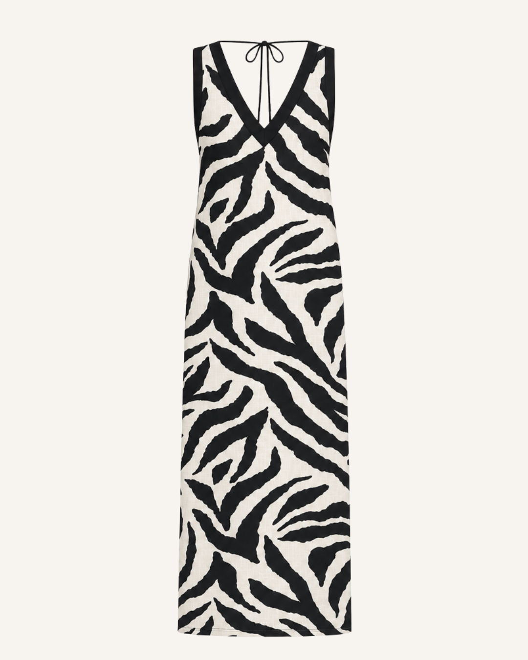 Ghost mannequin front view of cream linen-cotton V-neck maxi dress with black zebra print and contrast trim