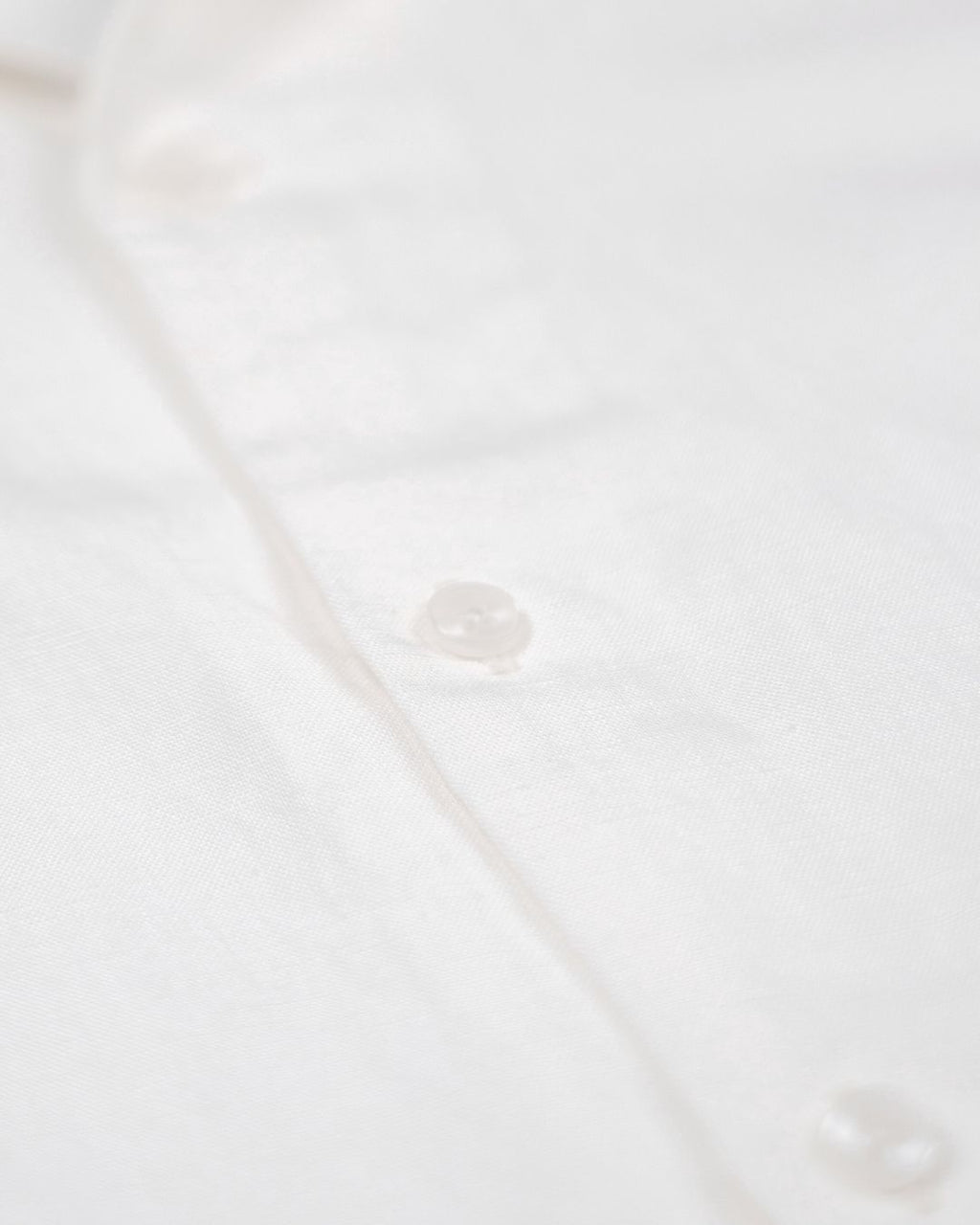 saigon concepts Hawaiian short sleeve aloha shirt 100% Linen shirt in natural white - button fabric detail view