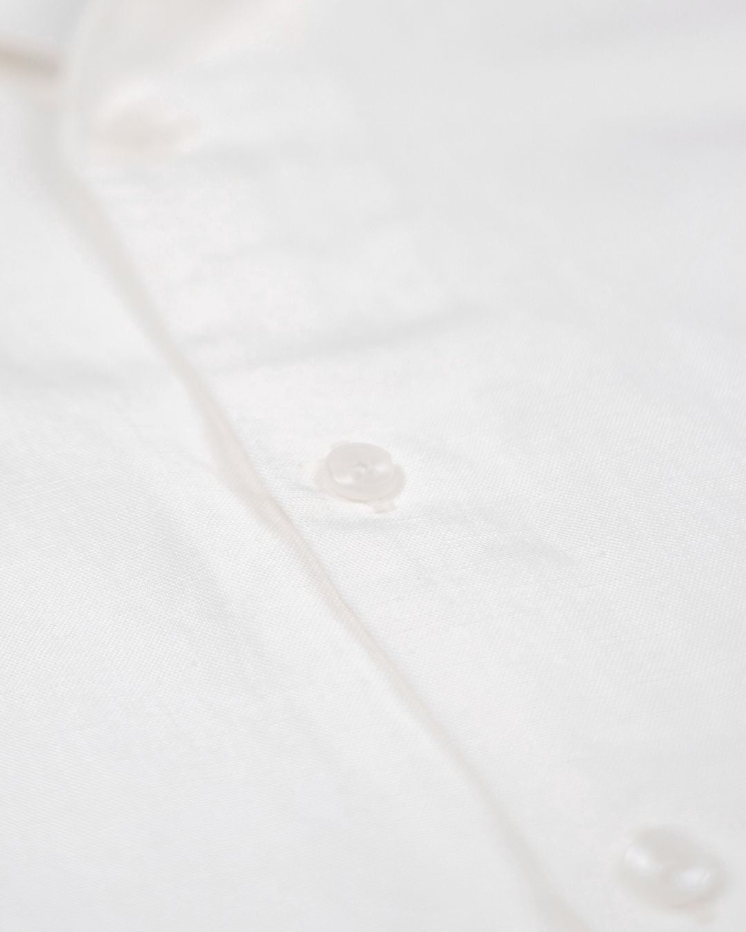 saigon concepts Hawaiian short sleeve aloha shirt 100% Linen shirt in natural white - button fabric detail view